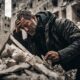 Man escaping collapsed building